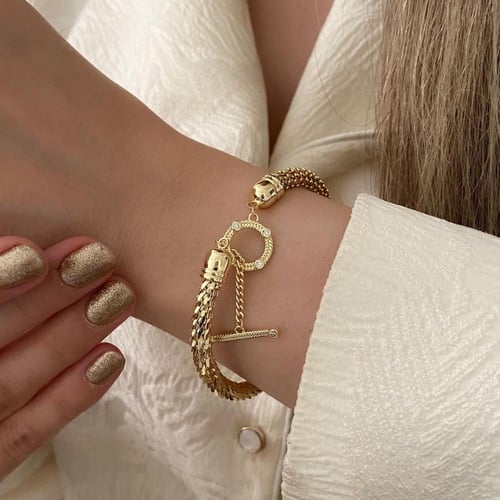 سوار صلب مفتوح مع قفل دائري مطلي ذهب. MB-208