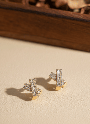 اقراط بتصميم شكل x مغطاة باحجار الباغيت مطلية ذهب...