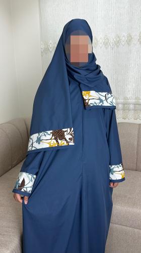 Prayer sheet, plain with zipper at the sleeve end, and the headscarf is floral.