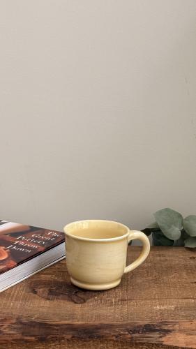 Cup with yellow handle