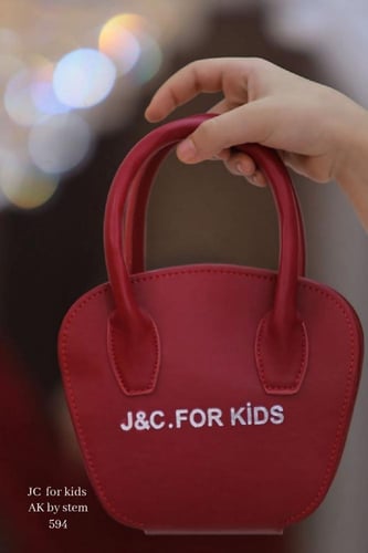 فستان رسمي بتصميم مميز مع شنطه