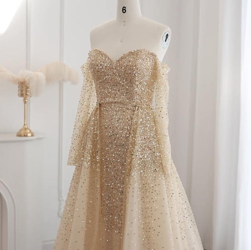 فستان سهرة فاخر ذهبي بتنورة قابل للفصل من سمارا بو...