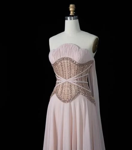 A soft evening dress with a pleated detail that enhances the waist, from Samara Boutique - S181