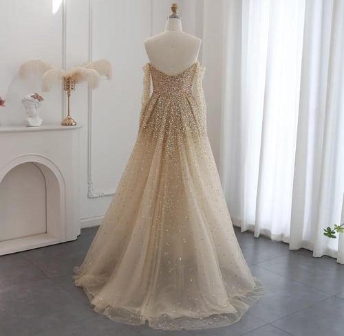 فستان سهرة فاخر ذهبي بتنورة قابل للفصل من سمارا بو...