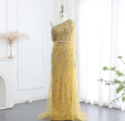 فستان سهرة باللون الأصفر الرائع وتطريز يدوي من سما...