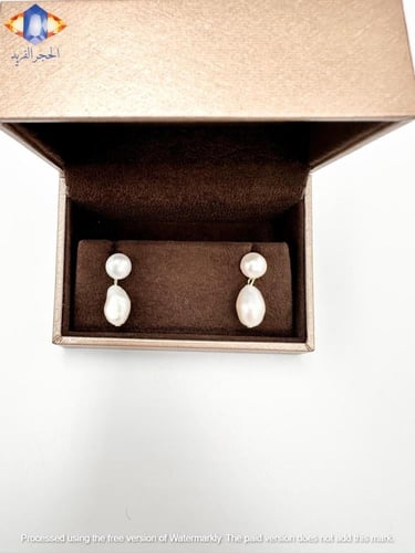 حلق ذهبي مرصع بلؤلؤ المياه العذبه الطبيعي .