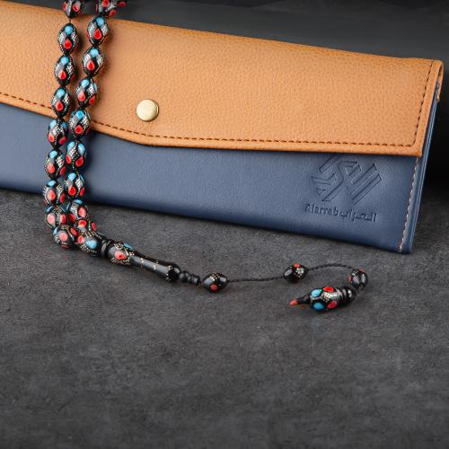 سبحه فاخرة من الخرز الأسود بنقشات ملونة