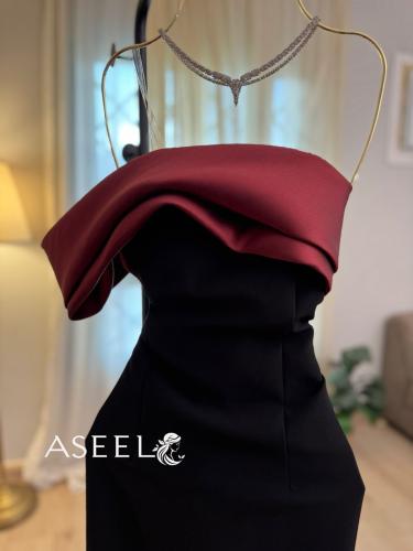 فستان سهرة اسود بذيل ميكادو