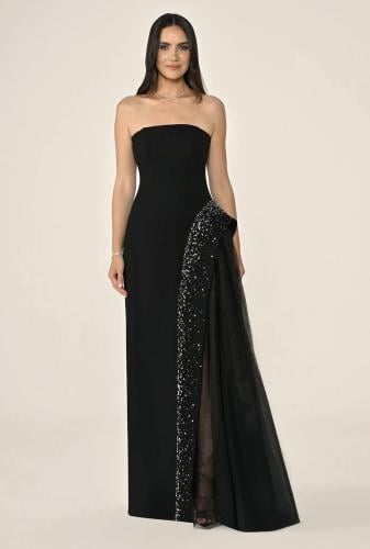 Long dress from crepe with tulle encrusted with beads from the side