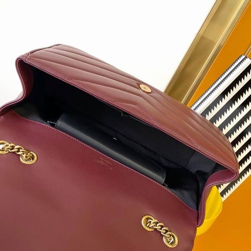 شنطة سان لوران عنابي