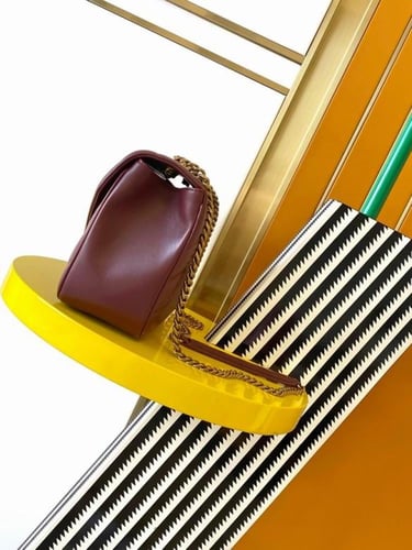 شنطة سان لوران عنابي