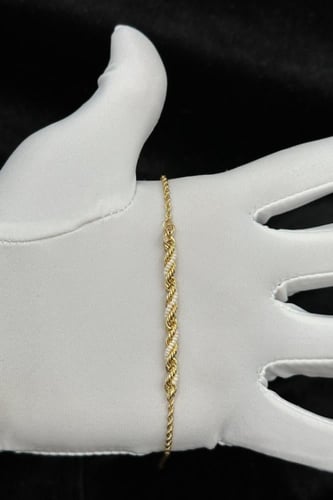 اسوارة ذهب مع لؤلؤ عيار 18 وزن الذهب من 1.16 الى 1...