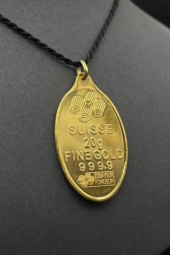 سبيكة ذهب وزن 20 جرام عيار 24 شكل بيضاوي مع عروه