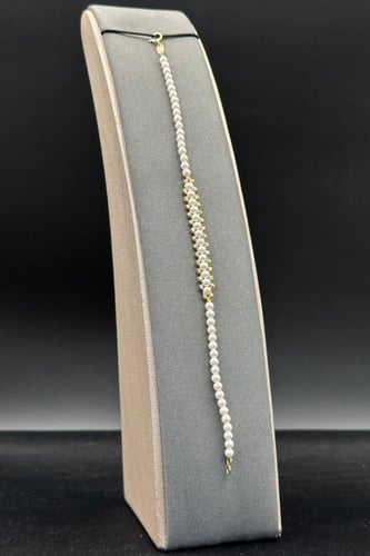 اسوارة لؤلؤ كور مع ذهب بلأطراف عيار 18 وزن 1.2جرام