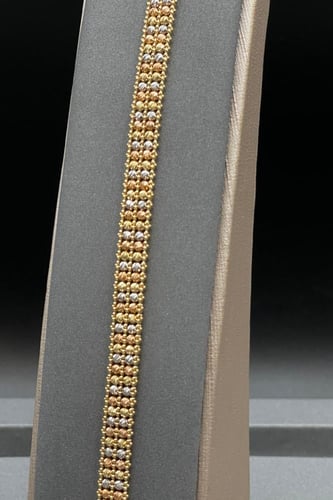 اسوارة ذهب عيار 18 بتصميم كور ذهبية صافية وزن 12.9...