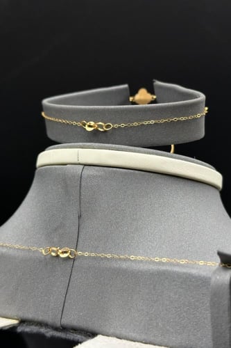 طقم مجدول مع وردة ذهب صافي عيار 21 وزن من 2.1 الى...