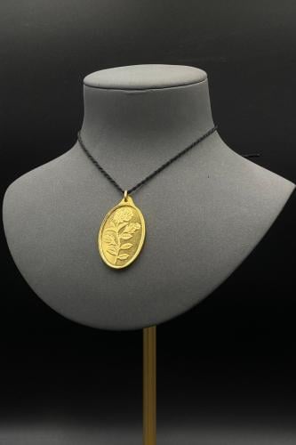 سبيكة ذهب وزن 1 اونصة عيار 24 شكل بيضاوي مع عروه