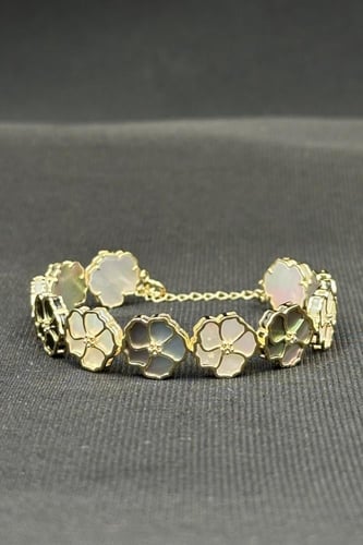 اسوارة اطفال ورد ذهب مع صدف ملون عيار 18 وزن من 7....