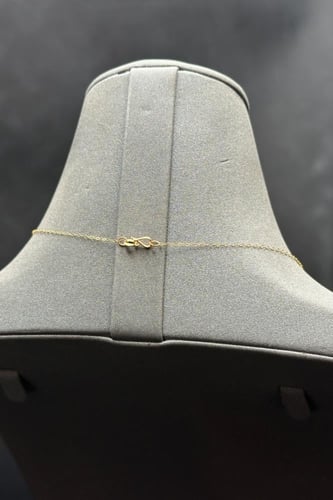 عقد دورين مجدول مع وردة ذهب صافي عيار 21 وزن من 0....