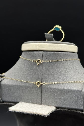 طقم وردة ذهب مع صدف فيروزي عيار 18 وزن من 2.7 الى...