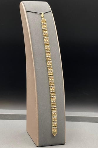 اسوارة ذهب عيار 18 بتصميم كور ذهبية صافية وزن 12.9...