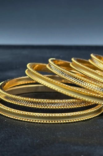 بناجر الوعد ذهب صافي بتصميم فاخر عيار 21 بأوزان مت...