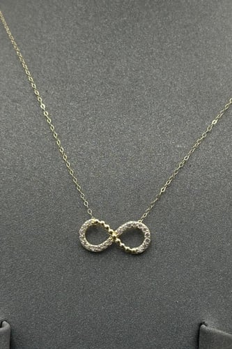 طقم اطفال انفنتي ذهب تصميم الماس عيار 18 وزن من 1....