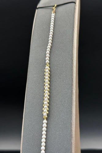 اسوارة لؤلؤ كور مع ذهب بلأطراف عيار 18 وزن 1.2جرام