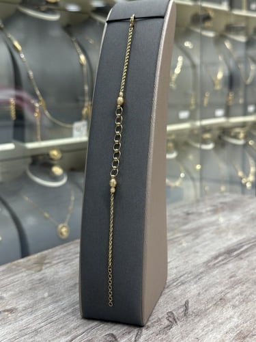 اسوارة ذهب عيار 18 مجدولة ودوائر مصممة بفخامة مثير...