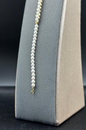 اسوارة لؤلؤ كور مع ذهب بلأطراف عيار 18 وزن 1.2جرام