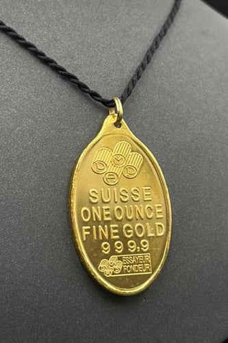 سبيكة ذهب وزن 1 اونصة عيار 24 شكل بيضاوي مع عروه