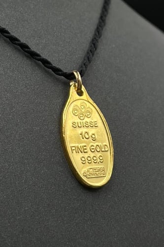 سبيكة ذهب وزن 10 جرام عيار 24 شكل بيضاوي مع عروه