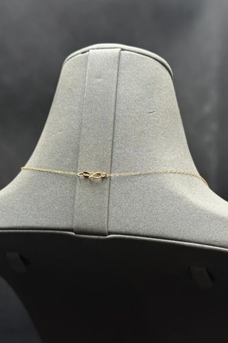 عقد دورين مجدول مع وردة ذهب صافي عيار 21 وزن من 0....