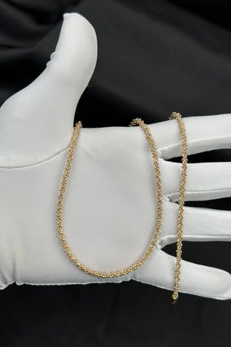 عقد مع اسوارة ذهب عيار 18 بتصميم كور وزن 18.9 جرام