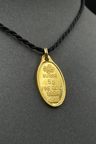 سبيكة ذهب وزن 5 جرام عيار 24 شكل بيضاوي مع عروه