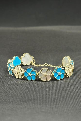 اسوارة اطفال ورد ذهب مع صدف ملون عيار 18 وزن من 7....