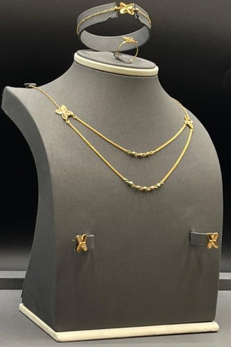 طقم شكل X ذهب صافي عيار 21