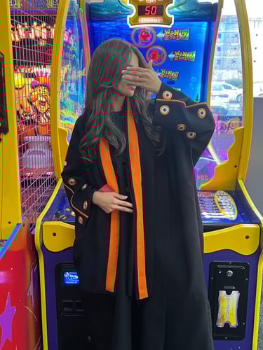 كريب كتان أسود بتطريز يدوي عيون اورنج