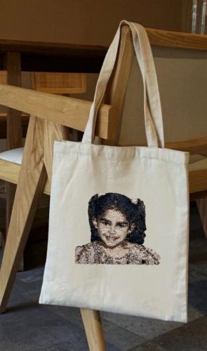 Embroidery of a portrait (portrait) on a cloth bag