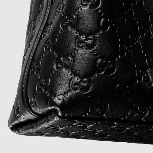 Gucci | GG Emblem small bucket bag | black GG leat...