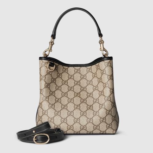 Gucci | GG Emblem small bucket bag | beige and dar...