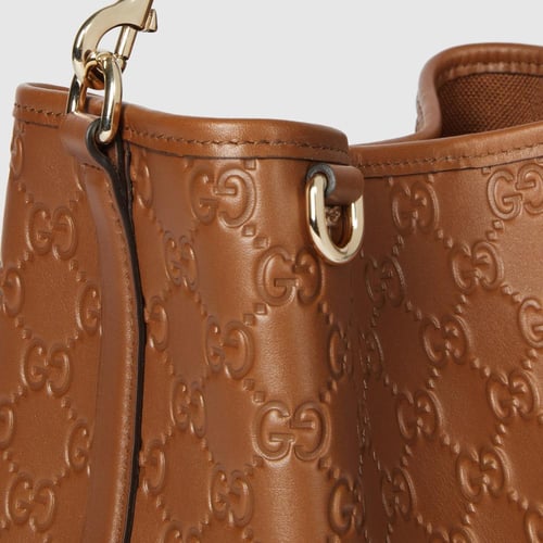 Gucci | GG Emblem small bucket bag | brown GG leat...