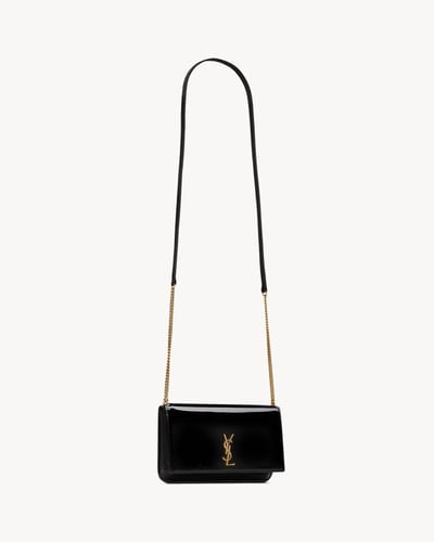 Saint Laurent | CASSANDRE PHONE CASE IN PATENT LEA...