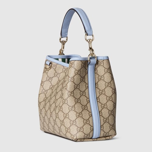 Gucci | GG Emblem small bucket bag | beige and dar...
