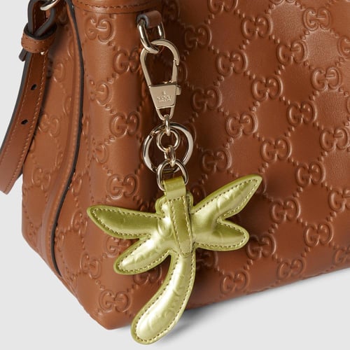 Gucci | GG Emblem small bucket bag | brown GG leat...