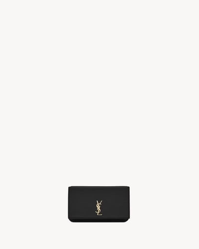 Saint Laurent | CASSANDRE LEATHER PHONE CASE | BLA...