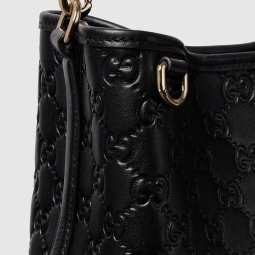 Gucci | GG Emblem small bucket bag | black GG leat...