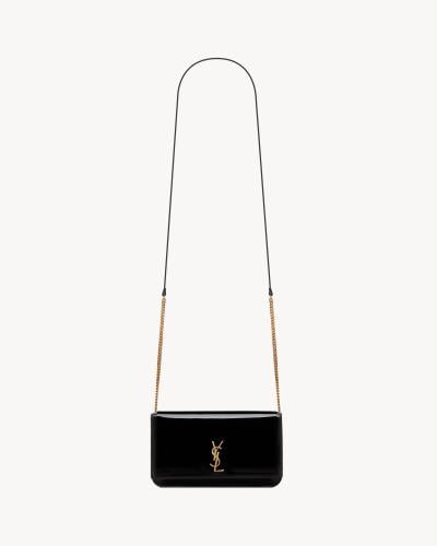 Saint Laurent | CASSANDRE PHONE CASE IN PATENT LEA...