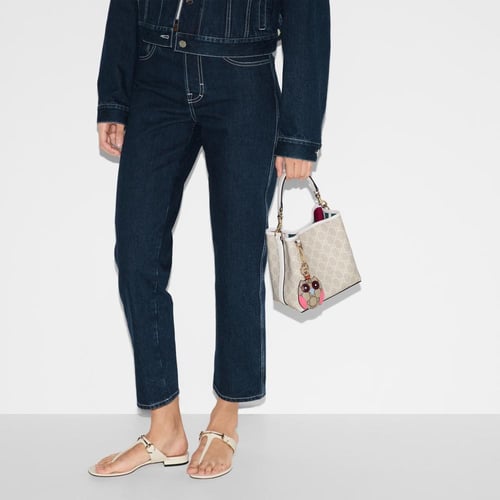 Gucci | GG Emblem small bucket bag | beige and whi...