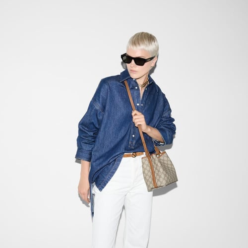 Gucci | GG Emblem small bucket bag | beige and dar...